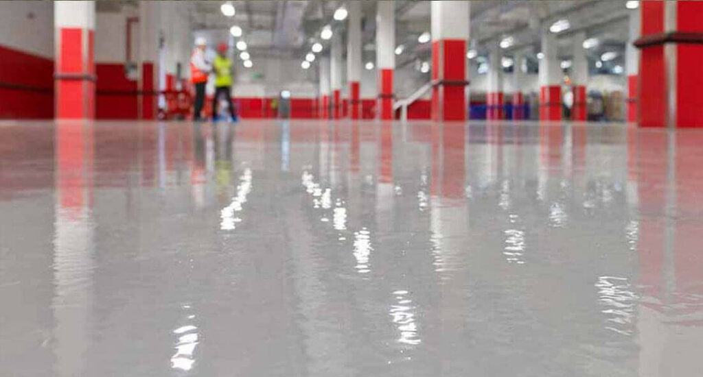 industrial-epoxy-flooring-resin-flooring-light-grey-close-up-red-background